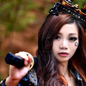 The world round, steampunk women are all the same. Tough, self reliant, confident, and armed!