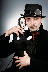 This Steampunk puppeteer seems to be channeling his inner Johnny Depp. WE love the puppet. It reminds us of Edgar Allen Poe. - image courtesy of trialbysteam.com