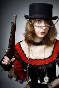 This young lady is definitely ready for a night on the town in Steampunk Moscow. Time pieces, hat, chains, and - of course that indispensable wardrobe accessory, a pistol. - image courtesy of trialbysteam.com  